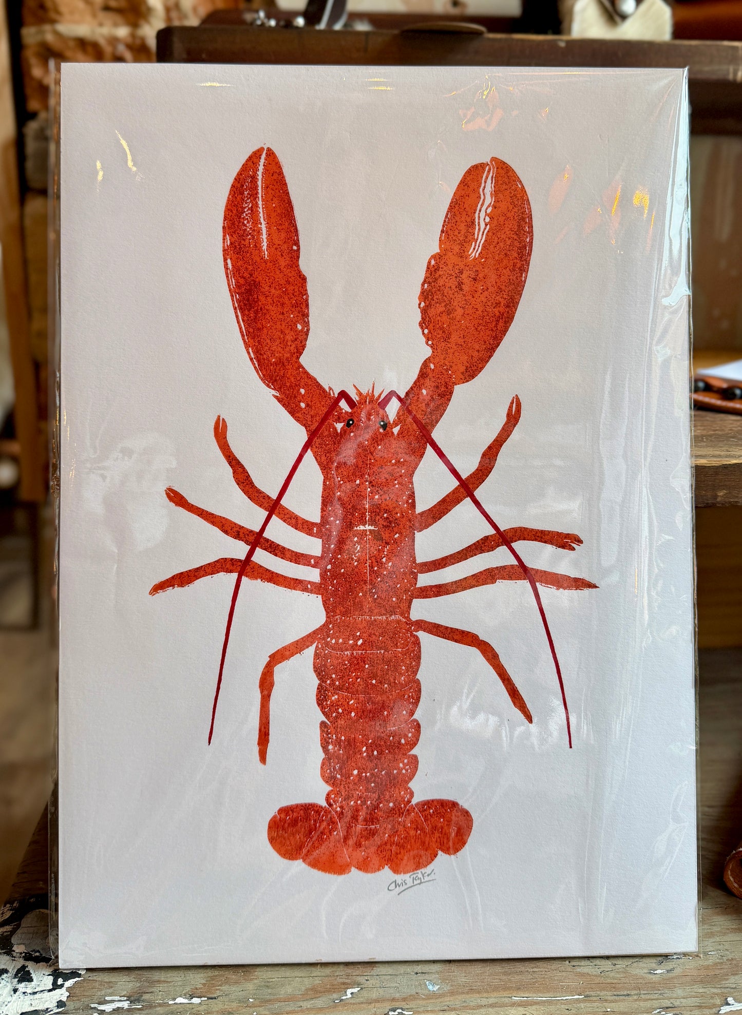 Linocut print of cooked lobster