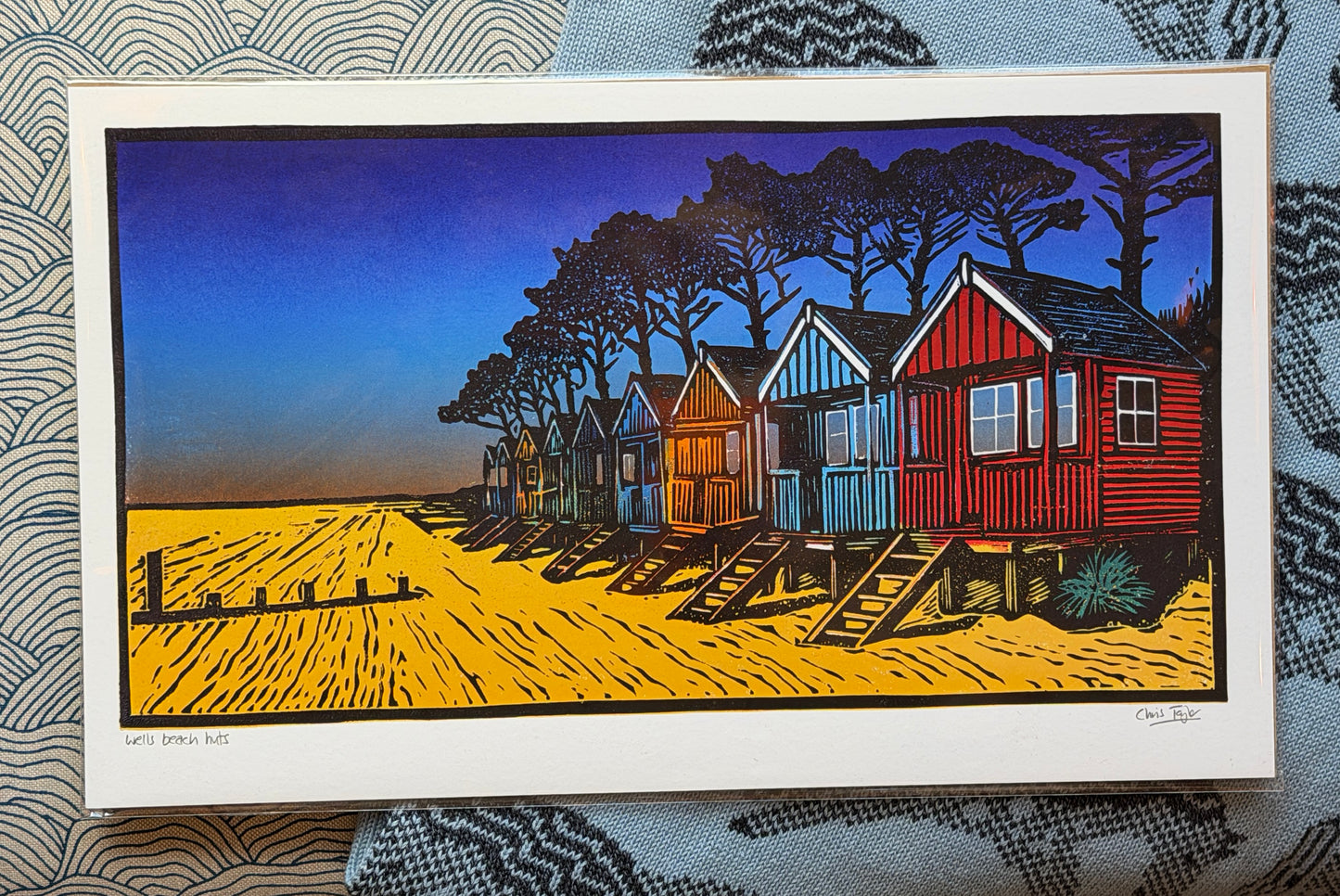 Wells beach huts in the gloaming - linocut print design